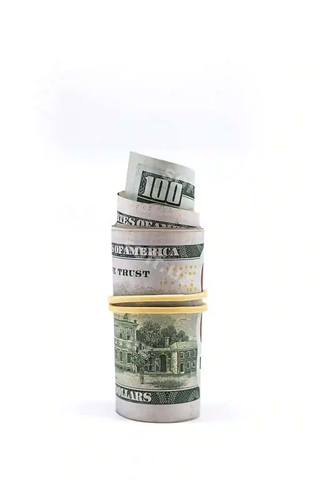 O'ralgan yuz dollarlik qog'oz pullar | Rolled up one hundred dollar bills white roll us paper currency