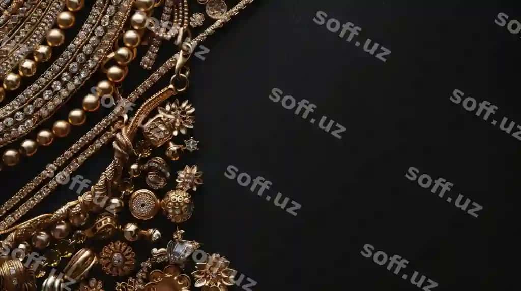 Qorong'i sirtga oltin zargarlik buyumlarini qo'ying | Set gold jewelry laid out dark surface