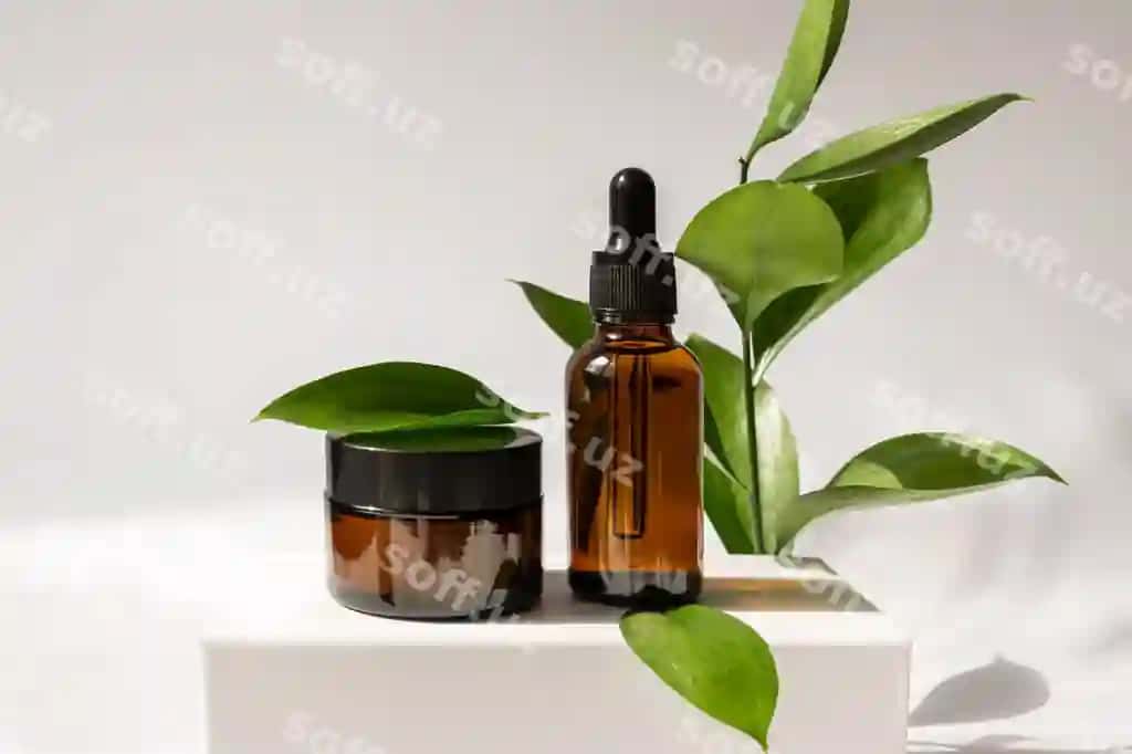 Nafis krem banka, serum shisha butilka, oq podium yashil varaq bilan. | Moisturizer cream jar serum glass bottle white podium with green leaves