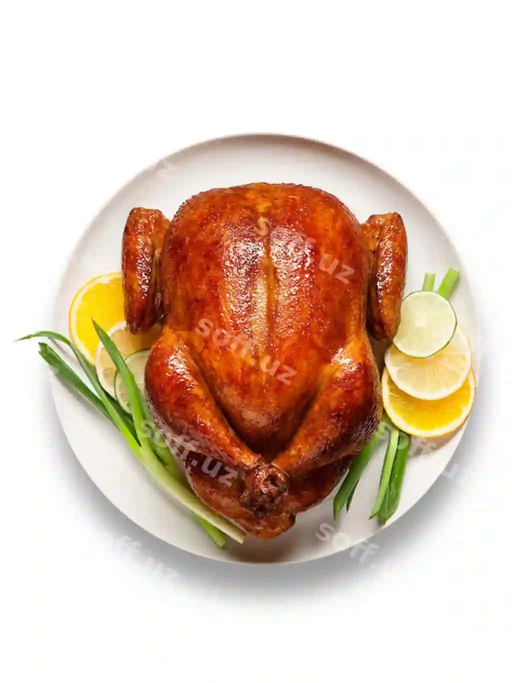 Menga yoqgan qovurilgan tovuq tsitrus dekoratsiyalari bilan oq likop | Delicious roasted chicken with citrus garnishes white plate